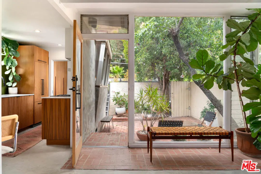 Discover 905 N Beverly Glen, a trophy home in the Star Homes Corridor. Featuring architectural pedigree, staff quarters, and investment-grade privacy. View listing details.